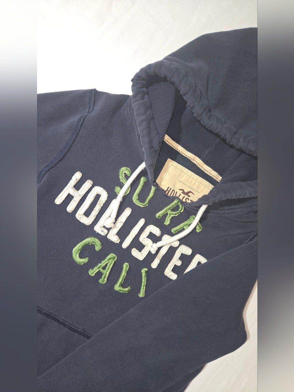 Hollister Navy Fall/Winter Hoodie with White Drawstrings and Green Cali Logo